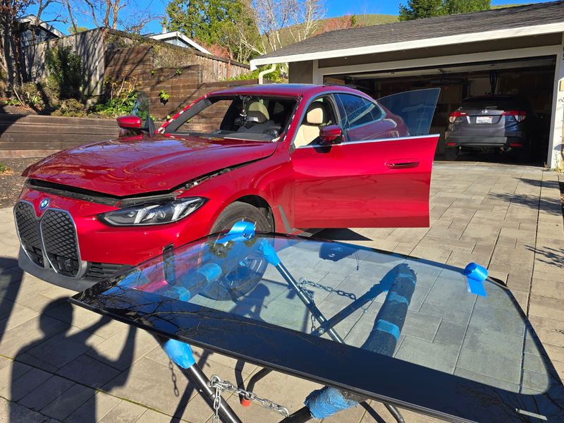 BMW iX windshield on stand ready for installation in San Francisco